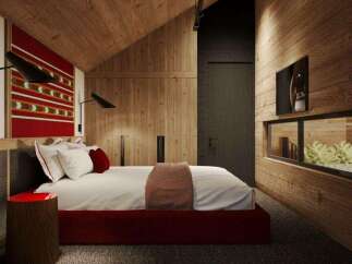 This stunning bedroom boasts a cozy and modern design, featuring a plush bed with a red base, complemented by a textured red and white wall hanging.