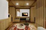 This stunning property boasts a spacious and bright living area with a cozy wooden interior.