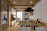 This stunning apartment boasts a spacious open-plan living area with a modern dining table and comfortable seating, perfect for entertaining guests.