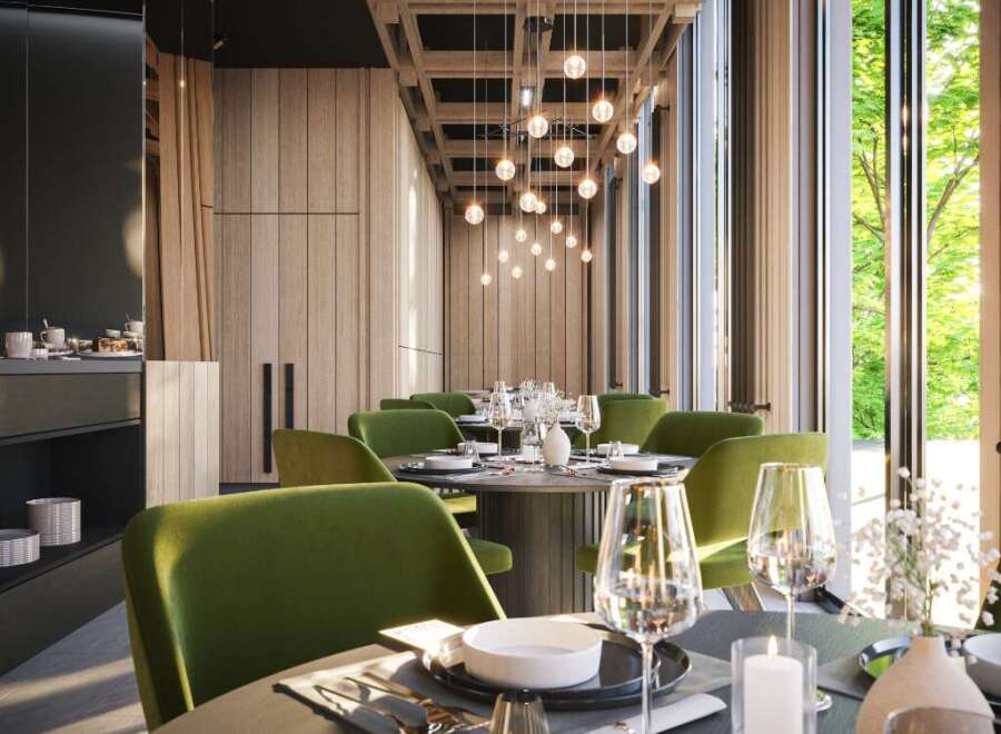 This stunning restaurant boasts a sophisticated design with floor-to-ceiling windows offering breathtaking views, complemented by warm wood accents and stylish green velvet chairs.