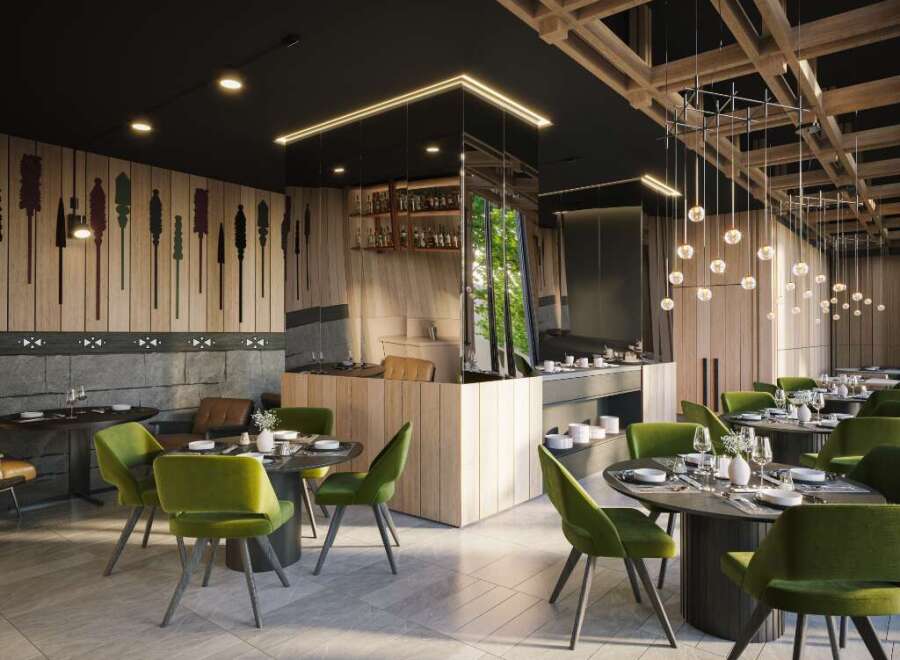 This modern restaurant boasts a sleek design with dark wood accents, green velvet chairs, and unique wall art.