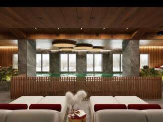 Indulge in tranquility at our luxurious spa, featuring a stunning indoor pool surrounded by floor-to-ceiling windows offering breathtaking views.