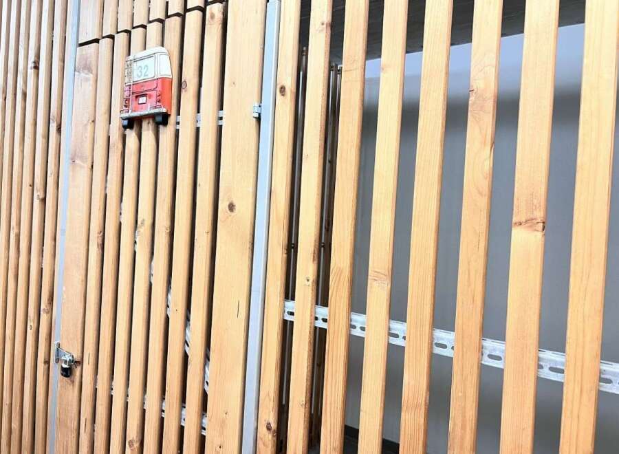 Explore the unique design of this property, featuring a stylish wooden slat facade.