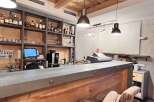 This stylish bar boasts a rustic wooden interior with a modern touch.