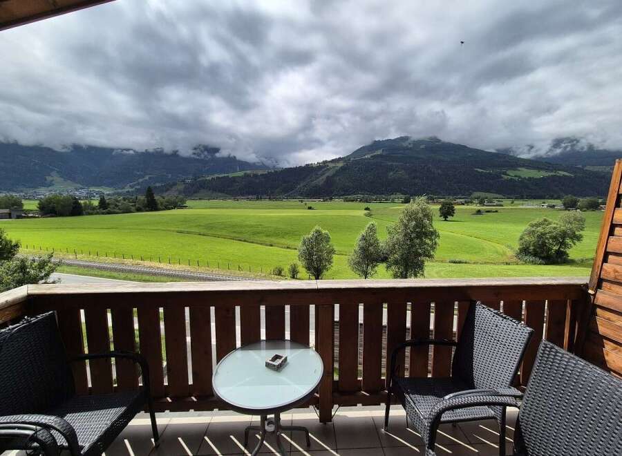 Enjoy breathtaking mountain views from this charming balcony.