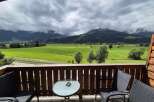 Enjoy breathtaking mountain views from this charming balcony.
