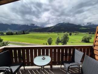 Enjoy breathtaking mountain views from this charming balcony.