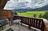 Enjoy breathtaking mountain views from this charming balcony.