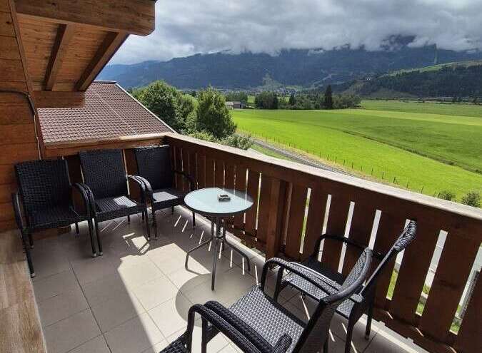 Enjoy breathtaking mountain views from this charming balcony.