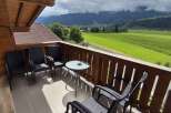 Enjoy breathtaking mountain views from this charming balcony.