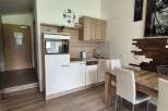 Discover a stylish kitchen with modern appliances and ample counter space, perfect for preparing delicious meals.