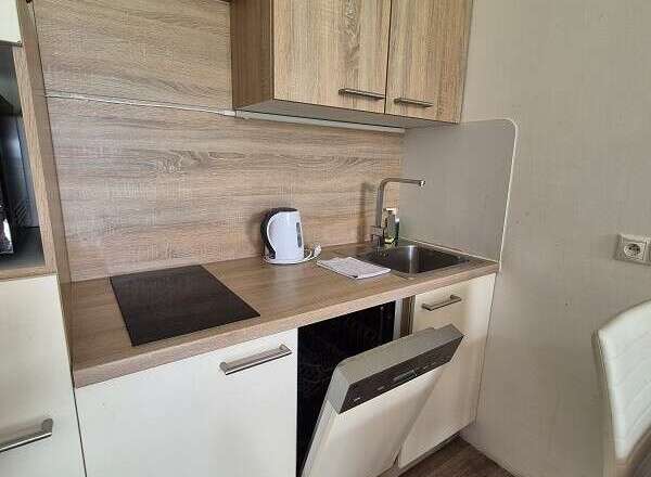 Discover a compact yet functional kitchen space, perfect for efficient living.