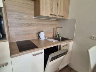 Discover a compact yet functional kitchen space, perfect for efficient living.
