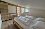 Cozy bedroom with a comfortable bed and fresh linens.