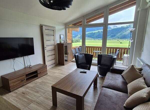Experience breathtaking mountain views from this stunning living space.