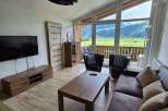 Experience breathtaking mountain views from this stunning living space.