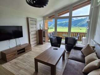 Experience breathtaking mountain views from this stunning living space.
