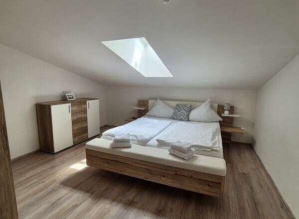 Discover a cozy bedroom retreat with a modern design.