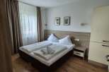 This cozy bedroom features a comfortable double bed with fresh linens and fluffy pillows.