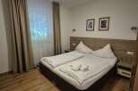 Cozy bedroom with a comfortable double bed, perfect for a relaxing stay.