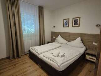 Cozy bedroom with a comfortable double bed, perfect for a relaxing stay.