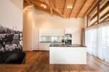 Experience modern living in this stunning kitchen with a sleek island and contemporary design.