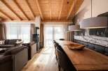 Experience rustic charm in this stunning property, featuring a warm wooden ceiling and inviting living spaces.