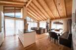 Experience luxury living in this stunning property, featuring a spacious open-plan design with a modern kitchen island.
