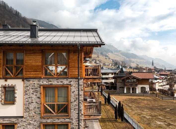 Experience the charm of this stunning property, featuring a blend of wood and stone architecture.