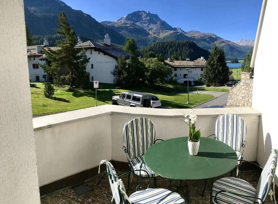 Enjoy breathtaking mountain views from this charming balcony.