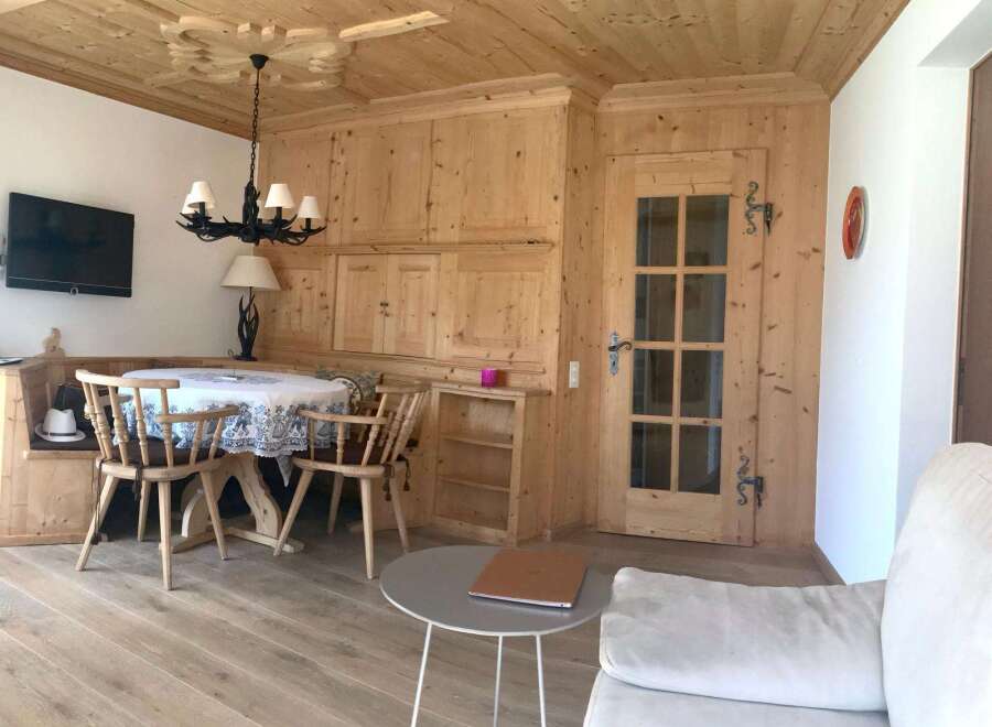 This charming property boasts a warm and inviting interior with beautiful wooden accents throughout.