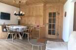 This charming property boasts a warm and inviting interior with beautiful wooden accents throughout.