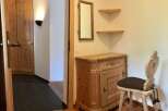 This charming property features a warm and inviting entryway with wooden accents.