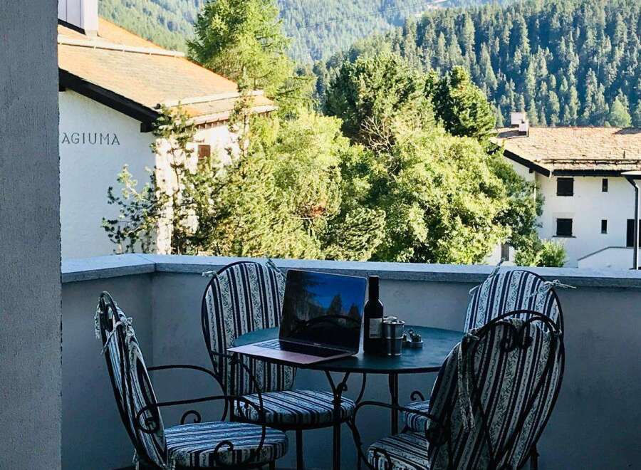 Enjoy breathtaking mountain views from this charming balcony.