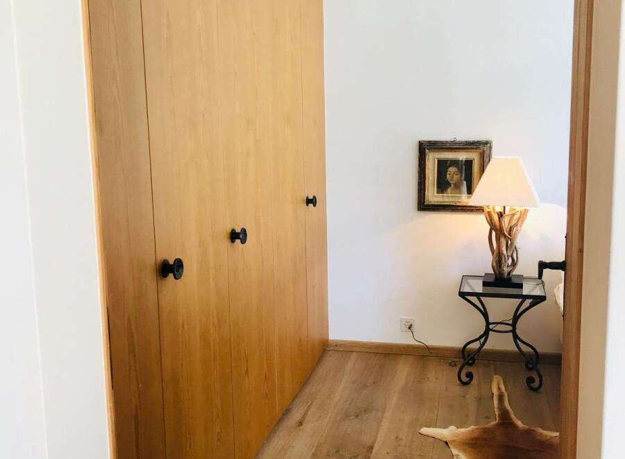 Discover the charm of this inviting space, featuring elegant wooden paneling and a warm, inviting atmosphere.