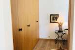 Discover the charm of this inviting space, featuring elegant wooden paneling and a warm, inviting atmosphere.