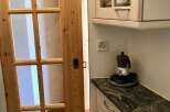 This charming property boasts a beautifully designed kitchen with a stylish granite countertop.