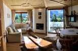 Experience the charm of this cozy living space, featuring a stunning fireplace and a warm, inviting atmosphere.