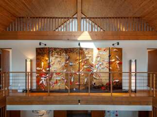 This stunning property boasts a spacious upper hallway with a captivating koi pond-themed artwork as a centerpiece.