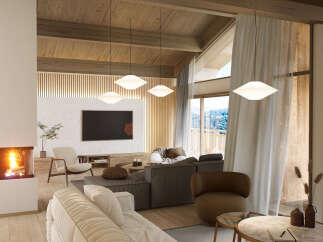 This stunning chalet boasts a spacious open-plan living area with floor-to-ceiling windows offering breathtaking mountain views.