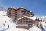 Experience luxury in this stunning ski-in/ski-out chalet, nestled amidst the breathtaking snowy mountains.