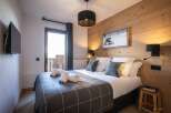 Cozy bedroom with a modern touch.