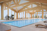 Experience luxury in this stunning indoor pool with breathtaking mountain views.