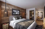 Experience rustic elegance in this stunning bedroom.