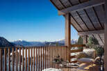 Experience breathtaking mountain views from this stunning balcony.