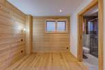 This stunning property boasts a warm and inviting interior with beautiful wooden accents throughout.