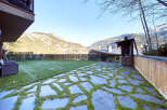This stunning property boasts a private garden with a beautiful stone patio, perfect for outdoor entertaining.