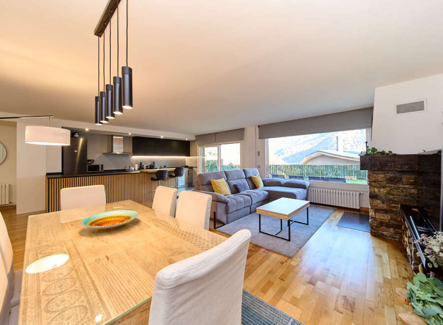 Stunning open-plan living space with modern kitchen, dining area, and comfortable lounge.
