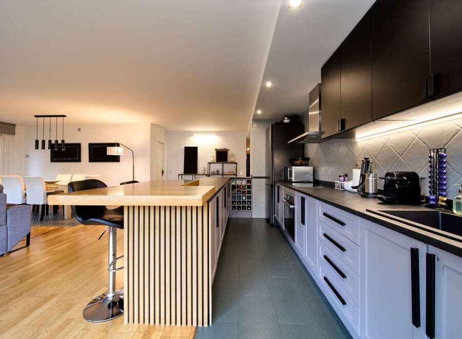 Stunning open-plan kitchen and living area with sleek modern design.