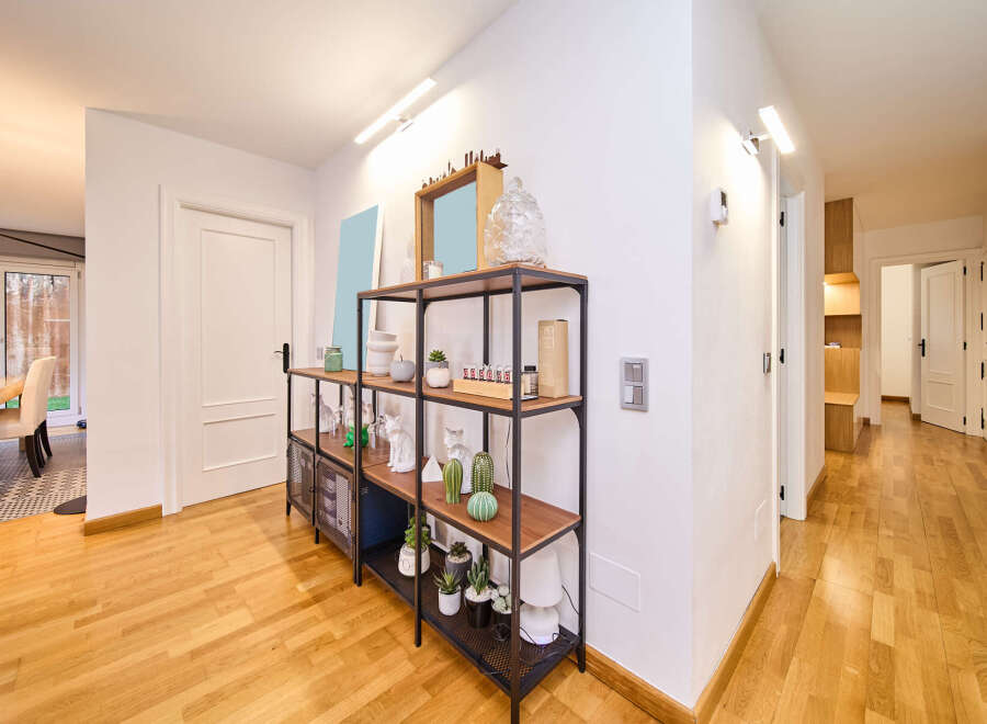 This stunning property boasts a bright and airy hallway with stylish wooden flooring.